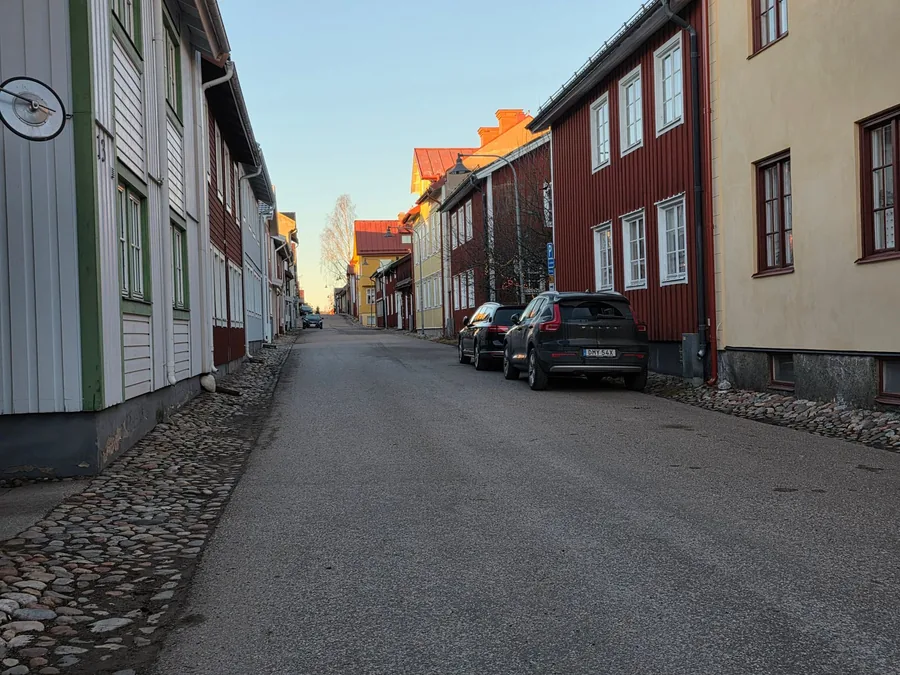 A car parked on a residential street of terraced houses