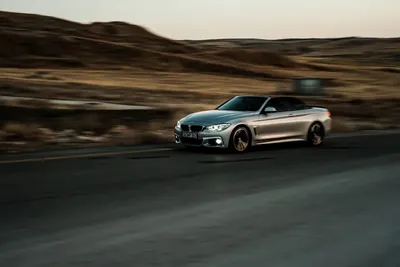 A car driving quickly on an open road