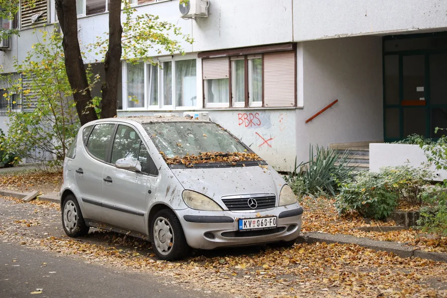 A compact car parked on a residential street