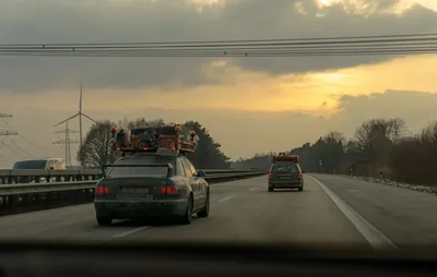 A car driving on a German motorway with traffic in the distance