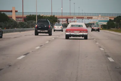 Cars driving on a multi-lane American highway on a clear day