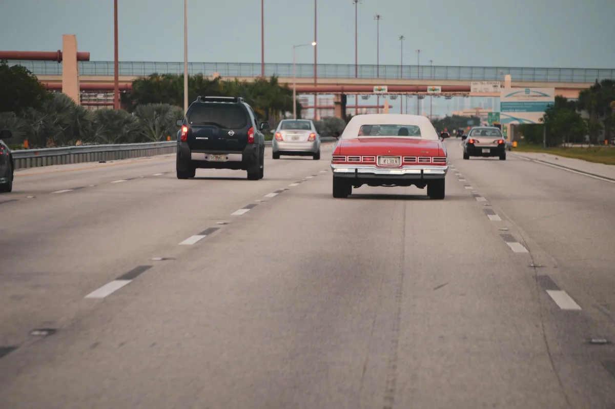 Cars driving on a multi-lane American highway on a clear day