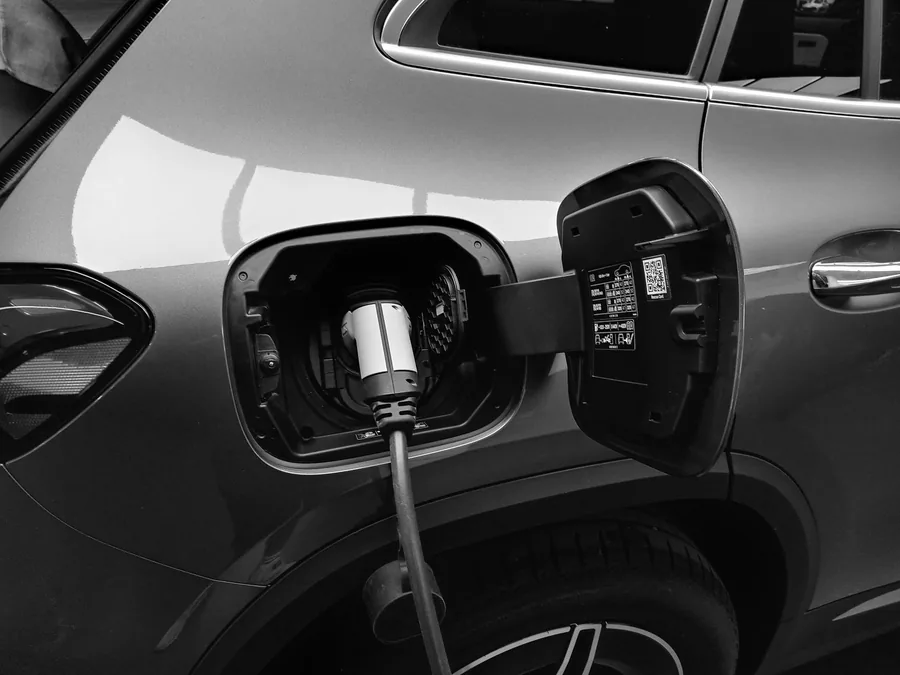 A Type 2 charging cable plugged into an electric car charging port