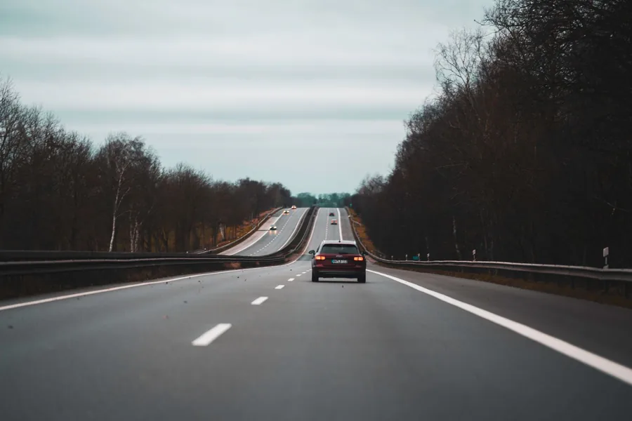 A car driving on a motorway on an overcast day